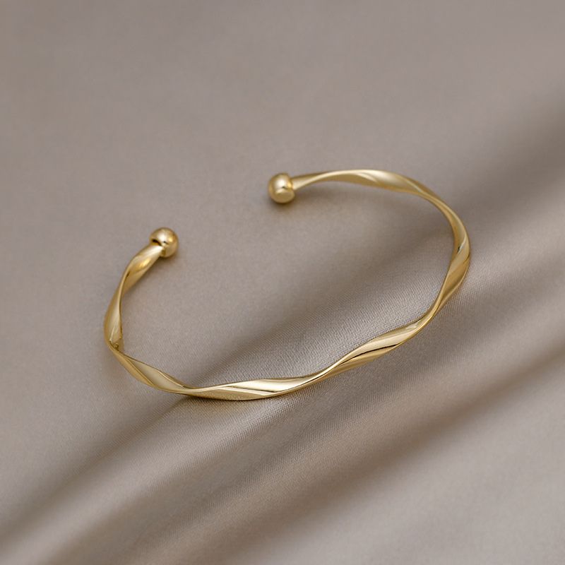 Bracelet jonc torsadé doré