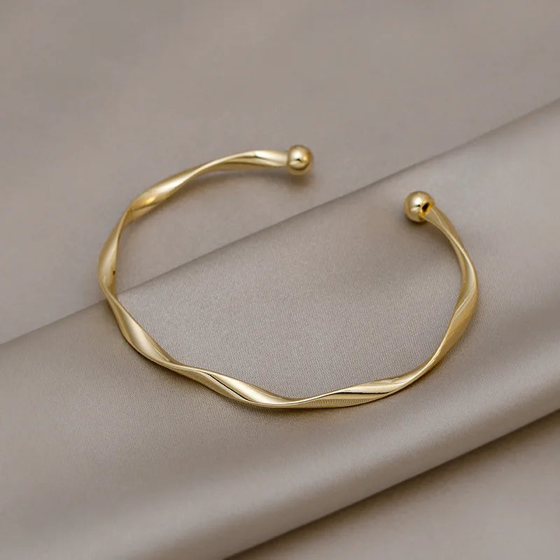 Bracelet jonc torsadé doré